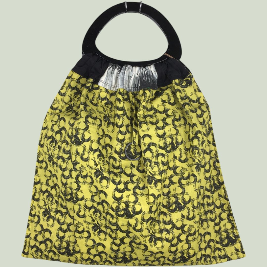 Los Angeles doublure 100% coton motifs vinyle jaune citron, petits cercles noirs sur fond jaune